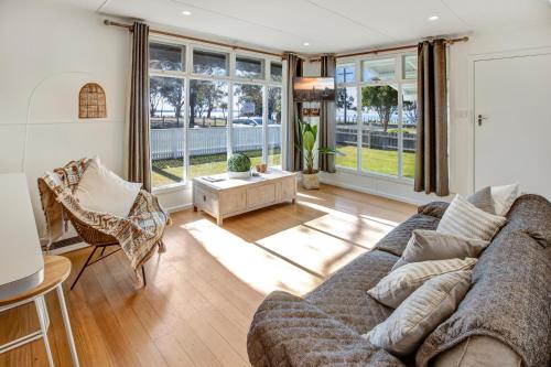 a living room with a couch and a table at The Shack in Eagle Point