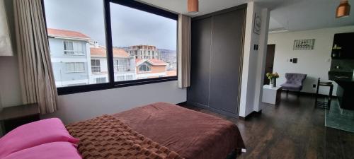 Ένα ή περισσότερα κρεβάτια σε δωμάτιο στο Cálido como el Hogar, Ubicación excelente