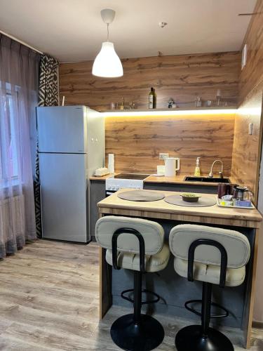 O bucătărie sau chicinetă la Studio Apt In UB