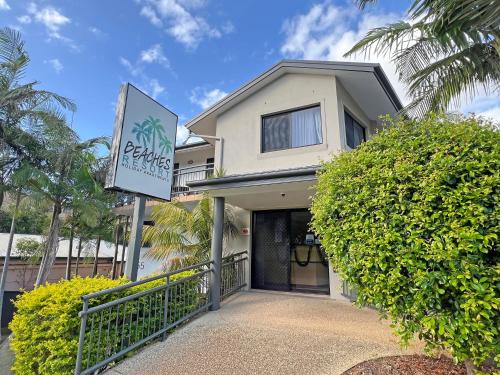 a house with a sign in front of it at Beaches Holiday Resort in Port Macquarie