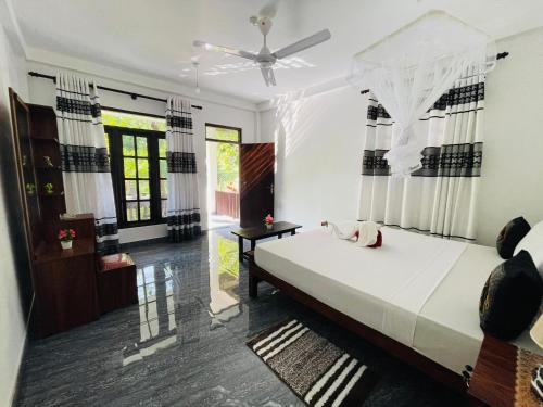 Postel nebo postele na pokoji v ubytování Dream Villa Sigiriya