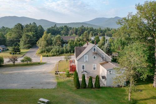 an aerial view of a house with a driveway at Allegory Inn in Twin Mountain