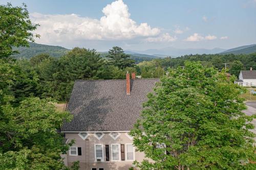 an overhead view of a house with trees at Allegory Inn in Twin Mountain