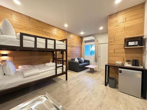 Ένα ή περισσότερα κρεβάτια σε δωμάτιο στο EbS Residence Chaweng