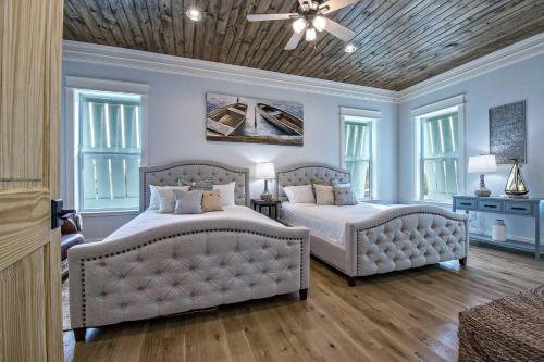 a bedroom with two beds and a couch at Cowboy at Sunset Key in Pensacola