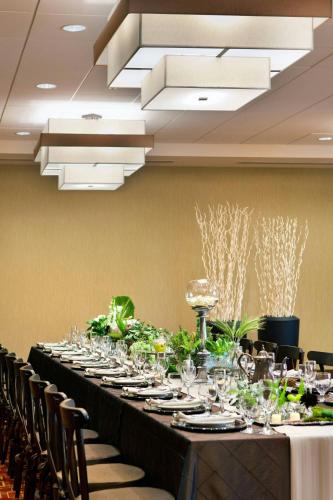 a long table in a room with chairs at Courtyard by Marriott Santa Barbara Goleta in Santa Barbara