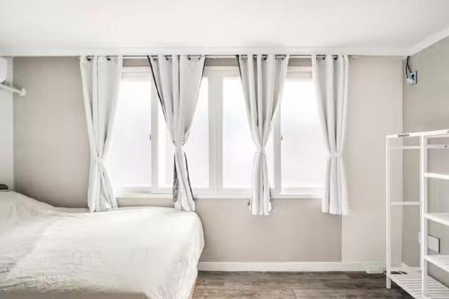 a bedroom with a bed and a window at Comfy & Cozy in Seoul