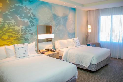 Ένα ή περισσότερα κρεβάτια σε δωμάτιο στο Courtyard by Marriott Fort Walton Beach-West Destin