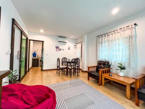 a living room with a couch and a table at Cute House in Local Area, near CMU in Chiang Mai