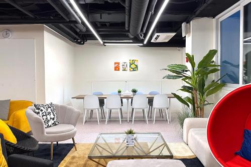 a living room with a table and chairs at OYO Hostel Myeongdong 6 in Seoul