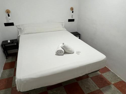 Postel nebo postele na pokoji v ubytování Lowcost Rooms