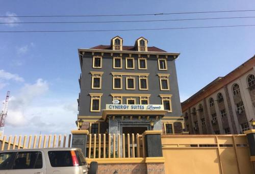 a building with a car parked in front of it at Cynergy Suites Royale - Standard in Lagos