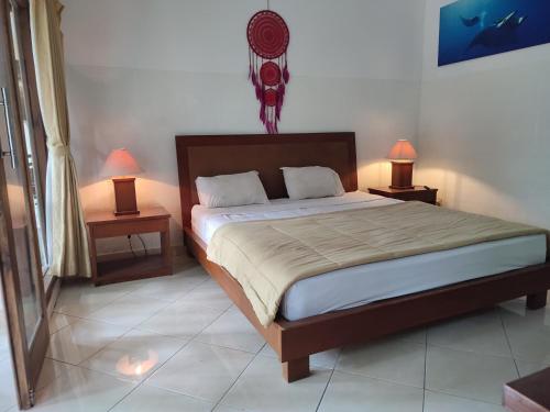 En eller flere senge i et værelse på Dhitabila