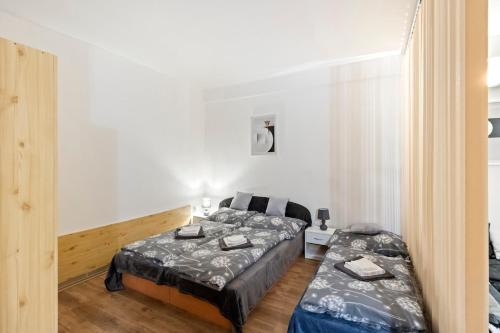 Postel nebo postele na pokoji v ubytování Útulný apartmán NIKI v srdci kúpeľov Patince