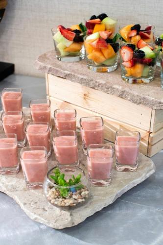 a table with several glasses of juice and bowls of fruit at Courtyard Washington, DC/U.S. Capitol in Washington