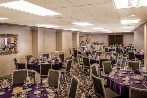a room with tables and chairs with purple tablecloths at Courtyard by Marriott Bethesda Chevy Chase in Bethesda