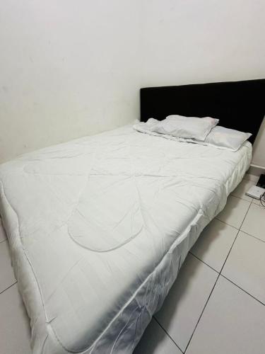 Cama o camas de una habitación en ML Homestay