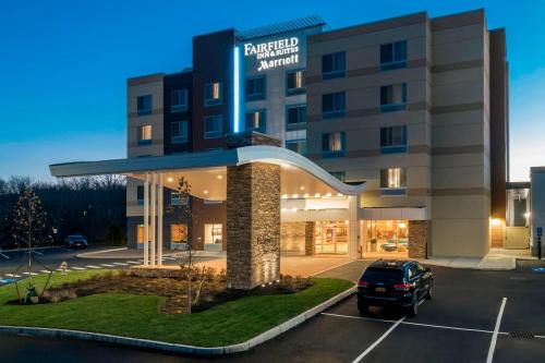 a hotel with a car parked in a parking lot at Fairfield Inn & Suites by Marriott Boston Marlborough/Apex Center in Marlborough