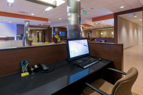a computer sitting on a desk in a lobby at Fairfield Inn & Suites by Marriott Boston Marlborough/Apex Center in Marlborough
