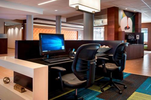 an office with a desk with a computer and chairs at Fairfield Inn & Suites by Marriott Buffalo Amherst/University in Amherst