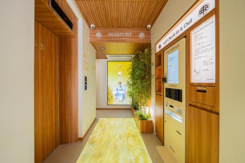 a corridor of an office with a hallway at 스테이 패스포트 후쿠오카 료칸 대전 유성점 in Daejeon