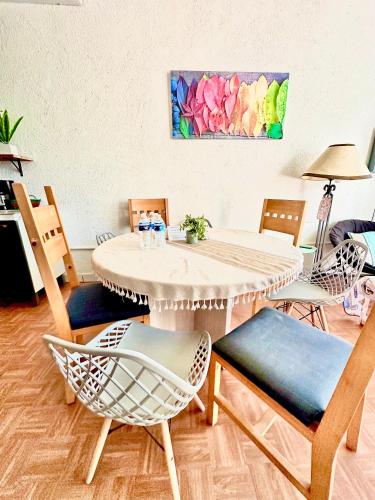 a dining room with a table and chairs at Departamento familiar equipado, 4 personas in Cabo San Lucas