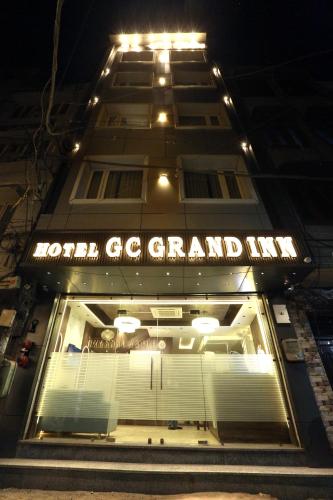 a building with a tennis court in front of it at Hotel GC Grand Inn By J R GROUP OF HOTELS in Amritsar
