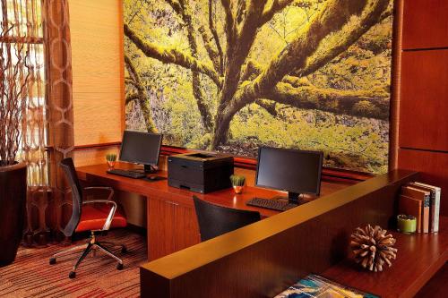 an office with two desks with two computers on them at Courtyard Seattle Sea-Tac Area in Tukwila