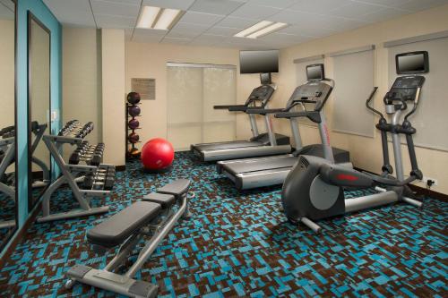 a gym with treadmills and ellipticals in a room at Fairfield Inn & Suites by Marriott Arundel Mills BWI Airport in Hanover