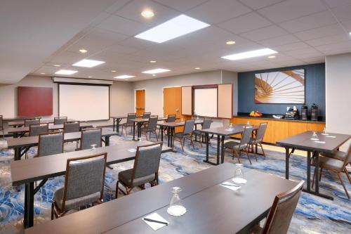 a classroom with tables and chairs in a room at Fairfield Inn & Suites Seattle Bellevue/Redmond in Bellevue