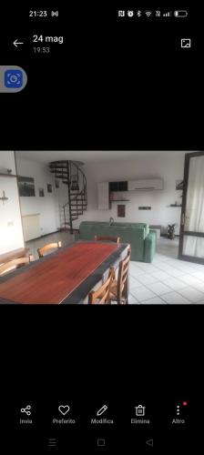 a picture of a room with a table and chairs at Esperia in Caorle