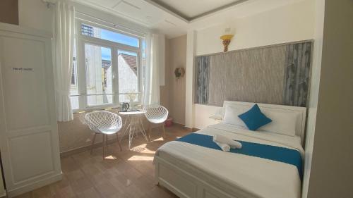 Postel nebo postele na pokoji v ubytování HUY HOANG II Hotel - Da Lat