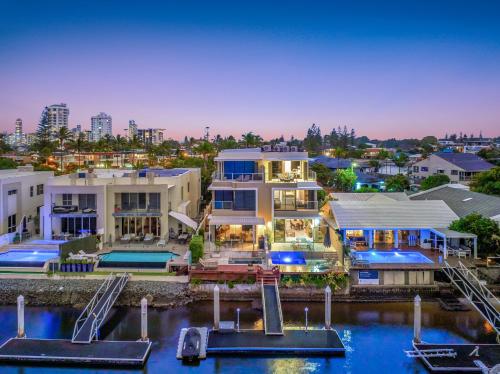a large house with a marina in a city at 3 m Luxury Waterfront Villa in Paradise Pets Welcome in Gold Coast