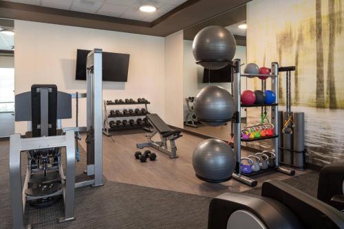 a fitness room with a gym with exercise equipment at Courtyard by Marriott Petaluma Sonoma County in Petaluma