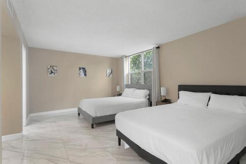 Katil atau katil-katil dalam bilik di Bay Harbor Sunset Apt 2A