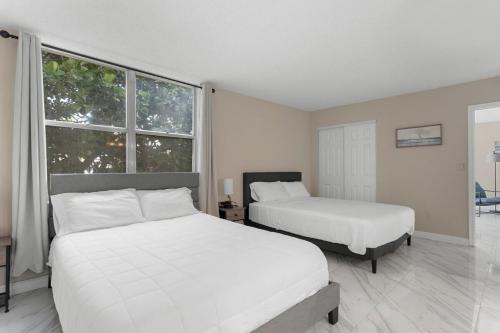 Katil atau katil-katil dalam bilik di Bay Harbor Sunset Apt 2A