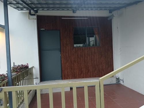 a front door of a house with a window at Sky Elanza in Munnar