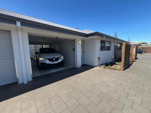 a car garage with a car parked in it at Clearwater Motel Apartments in Esperance