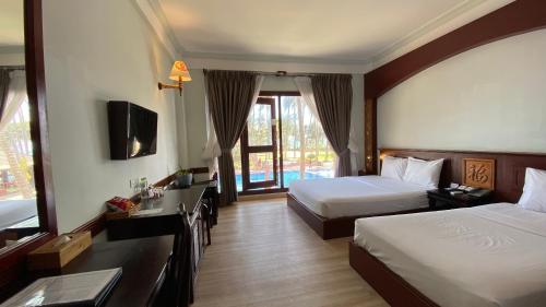 Katil atau katil-katil dalam bilik di Ca Ty Mui ne Beach Resort & Spa