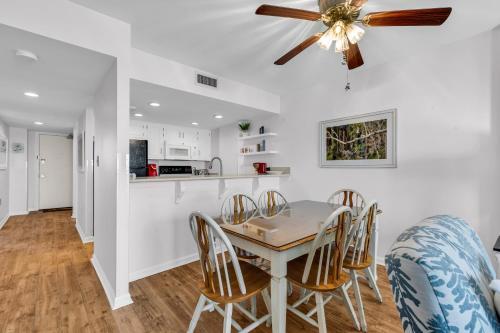 a kitchen and dining room with a table and chairs at Bluewater Resort 502 in Myrtle Beach