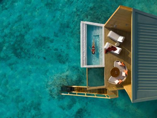 an aerial view of a resort on the water at Centara Mirage Lagoon Maldives in Nakachchafushi