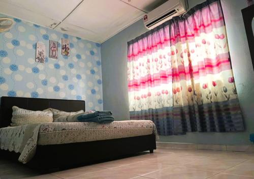 a bedroom with a bed and a large window at NO DEPOSIT - BIG Home 2-sty Terrace Near World Theme Park Hot Springs & Night Park max 6person in Ipoh
