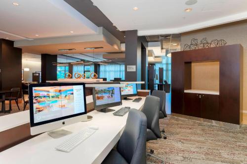 an office with two computer monitors on a desk at Courtyard by Marriott San Jose Campbell in Campbell