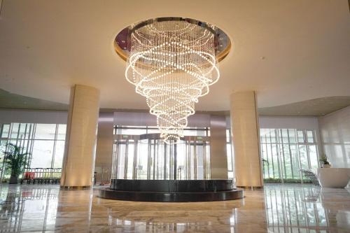 a large chandelier in the middle of a building at Wyndham Garden Jinjiang in Jinjiang