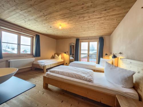 A bed or beds in a room at alpen select lodge Kleinwalsertal