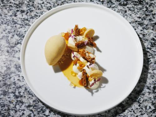 a dessert on a white plate on a table at The Omnia in Zermatt