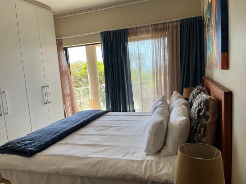 Ένα ή περισσότερα κρεβάτια σε δωμάτιο στο Margate Beach Apartment