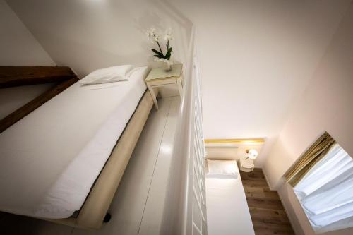 Una cama o camas en una habitación de Hotel Ai Dogi