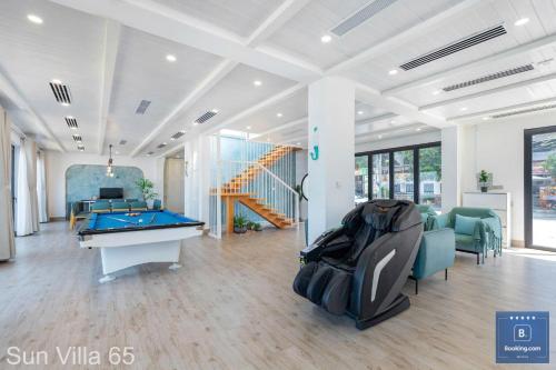 a room with a pool table and a staircase at Sun Villa 65 - View Biển Trực Diện in Vung Tau