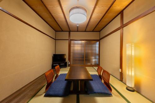 a conference room with a table and chairs at Nijo-Ouan in Kyoto